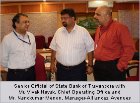 Senior Official of State Bank of Travancore with Mr.Vivek Nayak, Chief Operating Officer and Mr.Nandkumar Menon, Manager-Alliances, Avenues Senior Official of State Bank of Travancore with Mr.Vivek Nayak, Chief Operating Officer and Mr.Nandkumar Menon, Manager-Alliances, Avenues